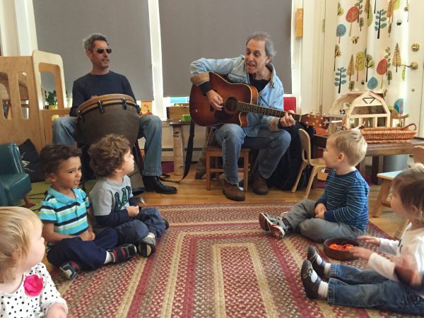 mr skip playing music for toddlers in the montessori classroom