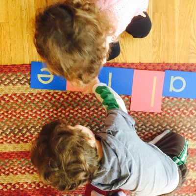 Montessori toddlers working with materials